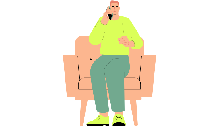 Ein Mann, der auf einem Sofasessel sitzt und telefoniert.